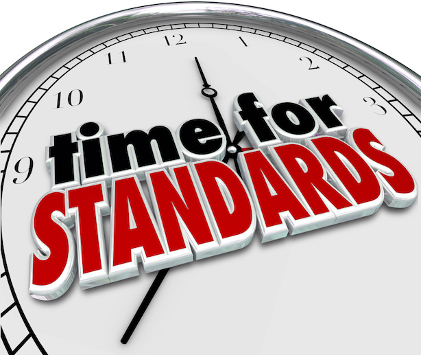 Time for Standards 3d words on a clock face to illustrate guidelines and regulations for measuring performance or quality